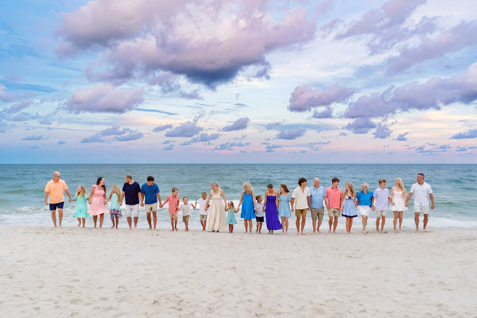 Thompson family walking the shoreline at Gulf Shores